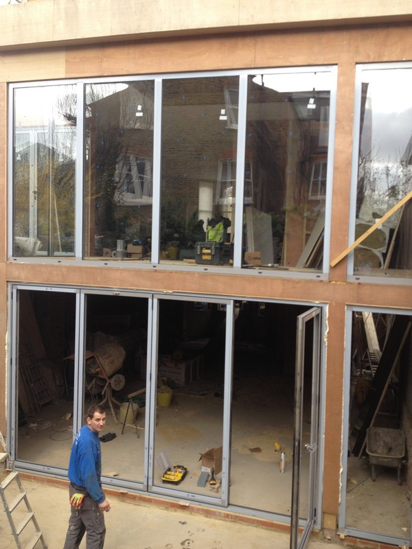 Aluminium bi-fold doors with two-storey glazing in South Lambeth