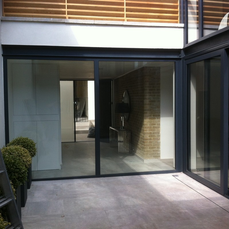 Floor-to-ceiling sliding doors opening to courtyard in South Lambeth